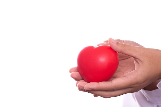 Woman holding heart, health care and health care concept and heart disease.