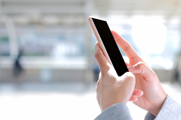 Woman holding the mobile phone