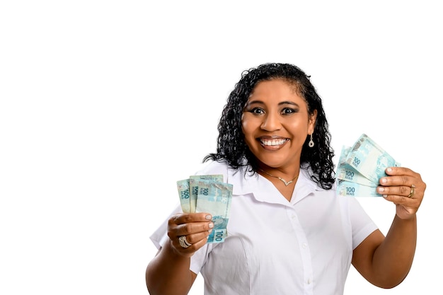 Woman holding money young smiling woman holding Brazilian money, white background