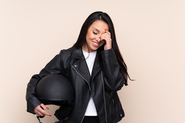 Woman holding a motorcycle helmet over isolated