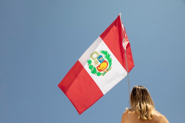 Woman holding the peru flag