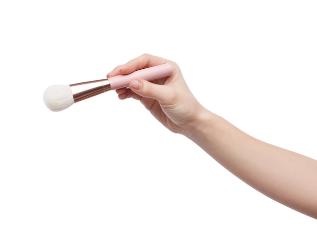 Woman holding professional make-up brush isolated on white background