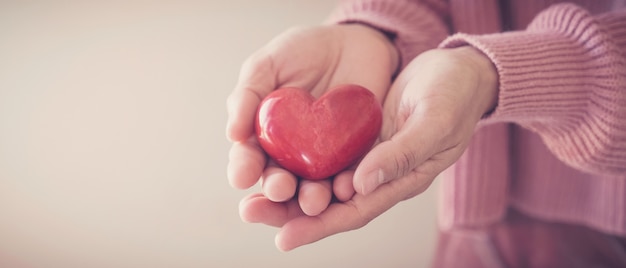 Woman holding red heart