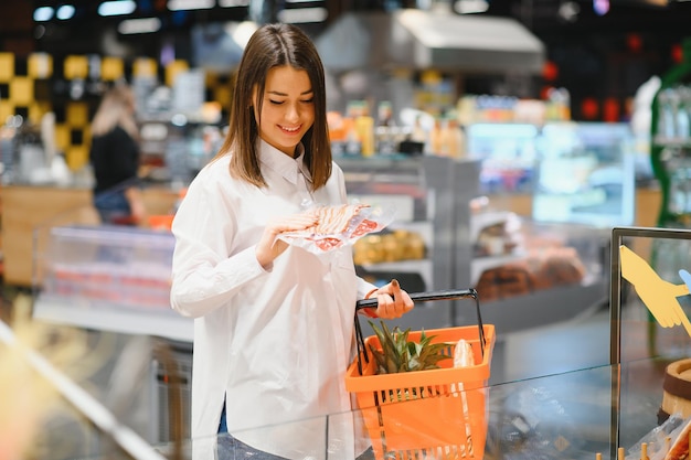 Woman holding a shopping bag of fresh food