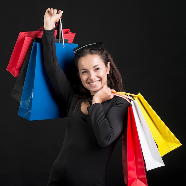 Woman holding shopping bags black friday shopping event