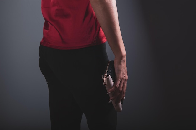 Woman holding a small bag in her hand