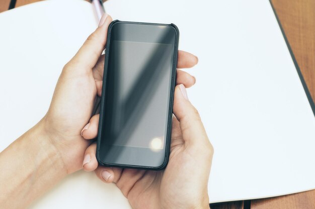 Woman holding smartphone