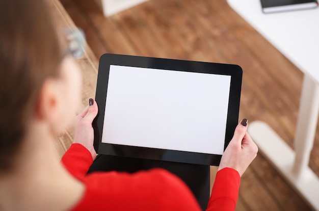 Woman holding tablet in hands