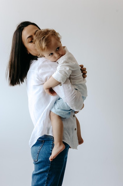 A woman holding a toddler in her arms