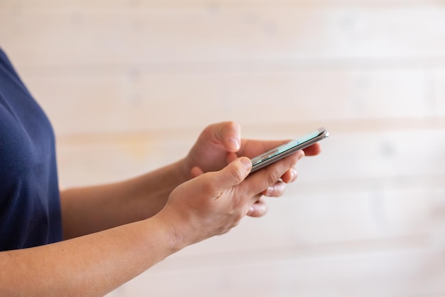 Woman holding using smart phone and reading phone