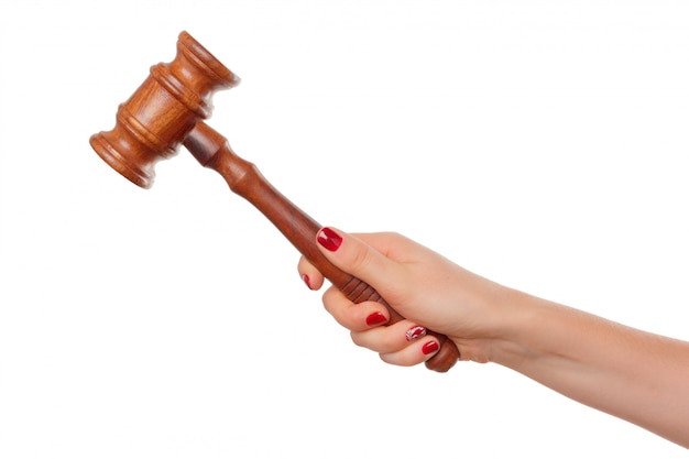 Woman Holding Wooden Gavel in Her Fist Isolated on White