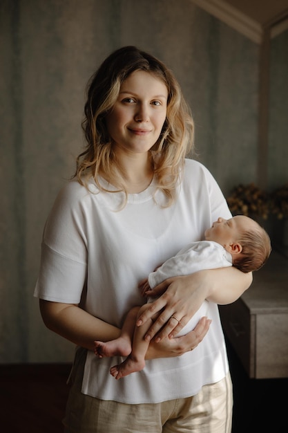 a woman holds a baby in her arms