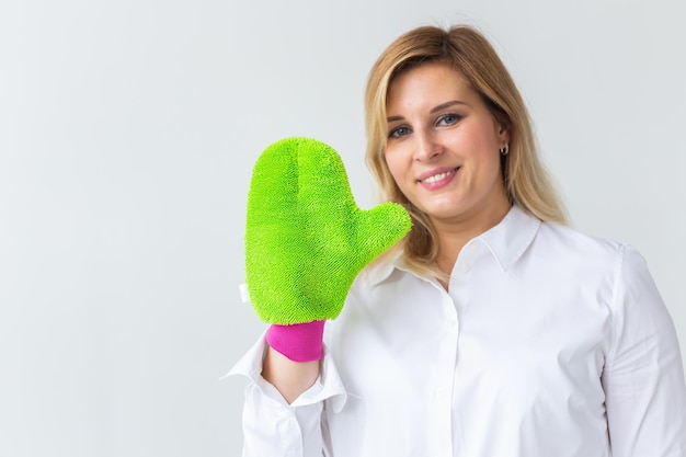 Woman holds shower massage sponge bath and body care