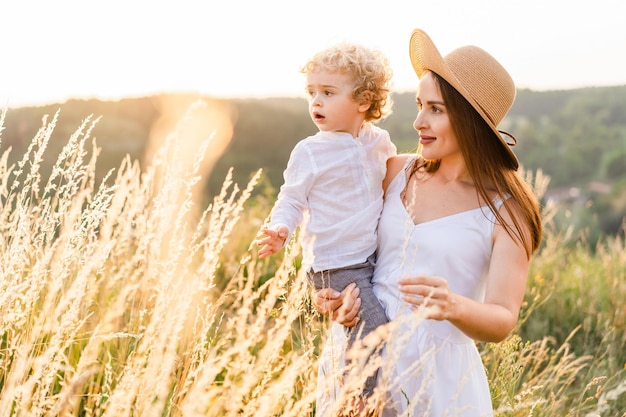 Woman holds surprised boy in her arms