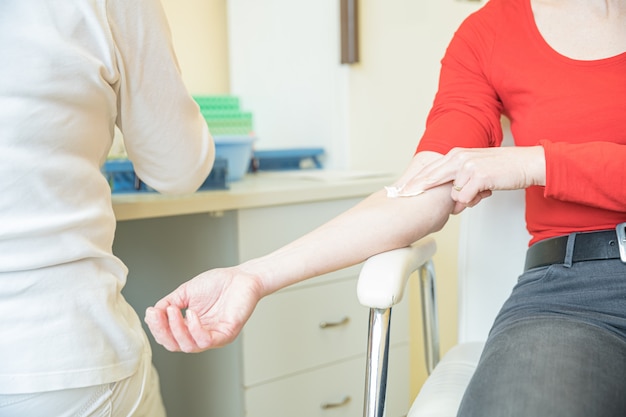 Woman in hospital for blood collection. Blood tests for the disease in the laboratory