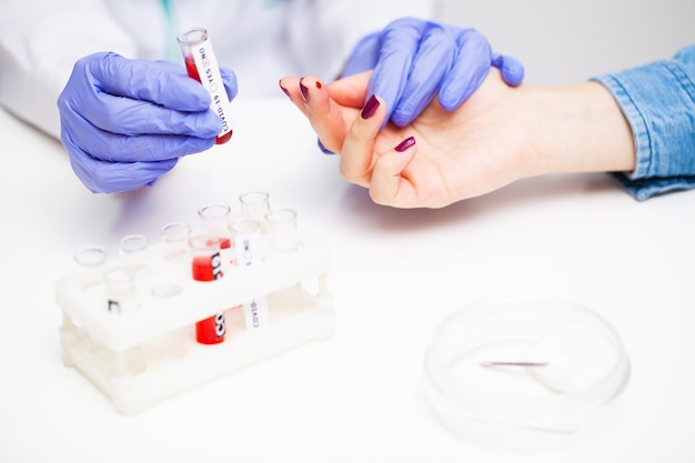 Woman at the hospital submits a blood test for a coronavirus.