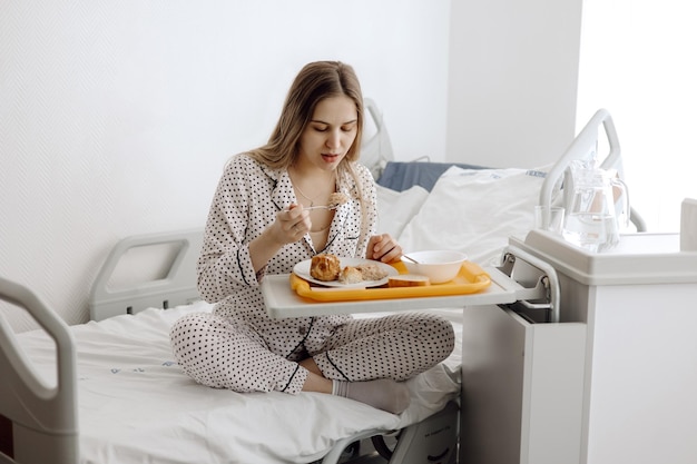 A woman hospitalized has lunch woman eating in hospital