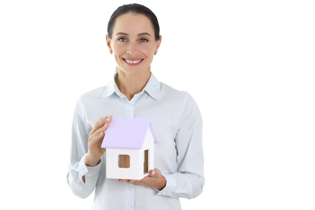 Woman insurance agent holding toy house in her hands on white background house design concept