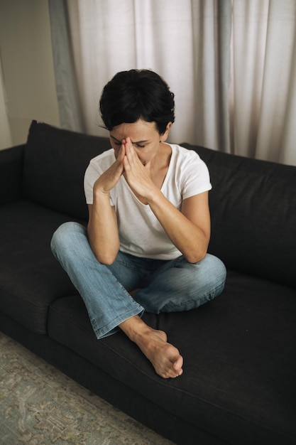 Woman is crying closing her face with hands Woman in depression Domestic violence and divorce