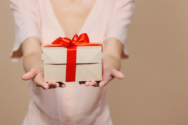 Woman is holding a box with a gift for Christmas or birthday a surprise sale poster for a cosmetics or jewelry store