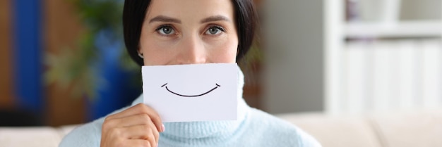 Woman is holding piece of paper with smile positive mood and emotions concept