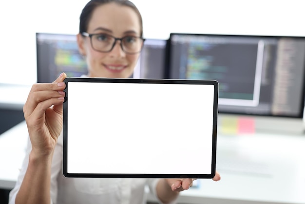 Woman is holding tablet with white screen at work advertising business offer concept