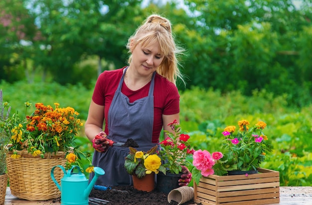 A woman is planting flowers in the garden Selective focus