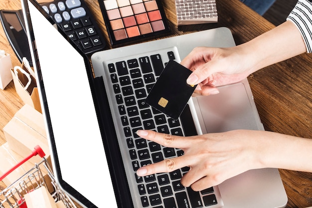 woman is using a computer to shop online