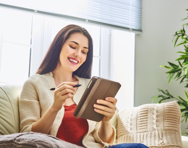 Woman is working on tablet