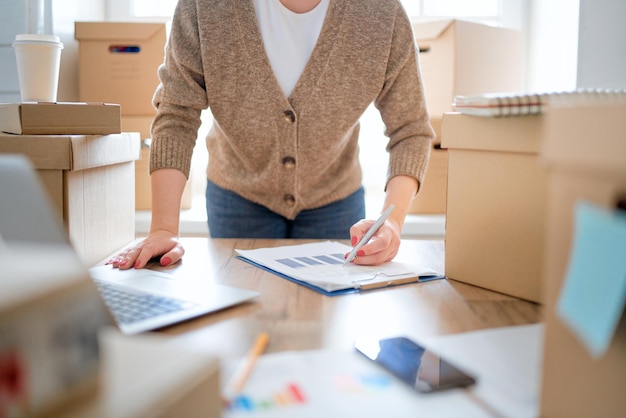 Woman is working at warehouse for online store