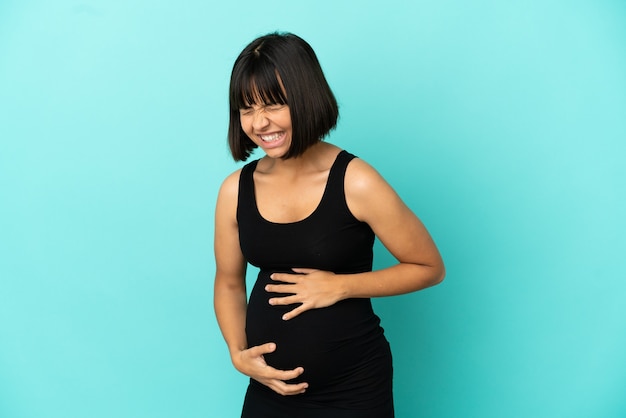 Woman over isolated background pregnant