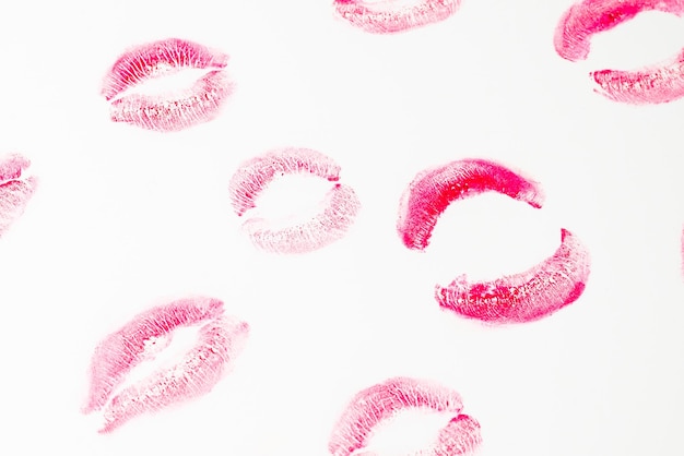 Woman kiss isolated on white background. Red lipstick.