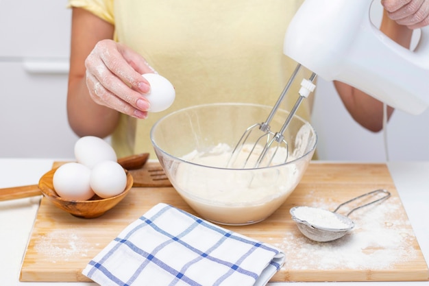 Woman in kitchen baking close up