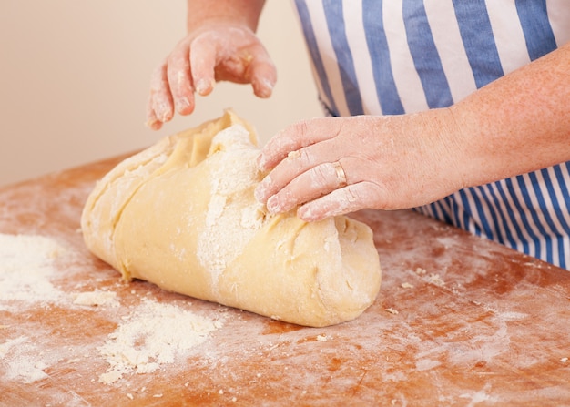 Woman kneading dough