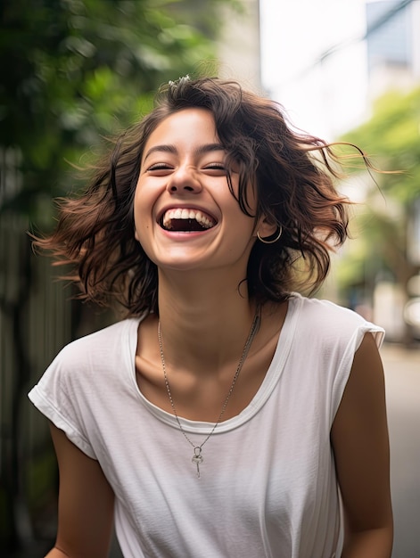 a woman laughing with her hair blowing in the wind