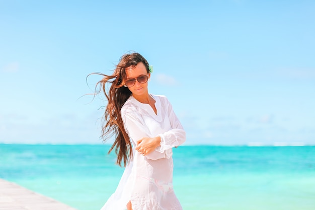 Woman laying on the beach enjoying summer holidays