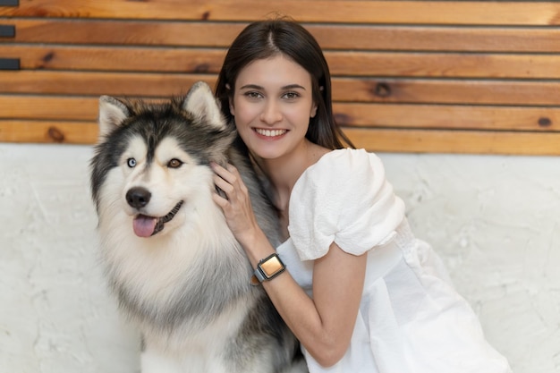 Woman laying on floor with a dog