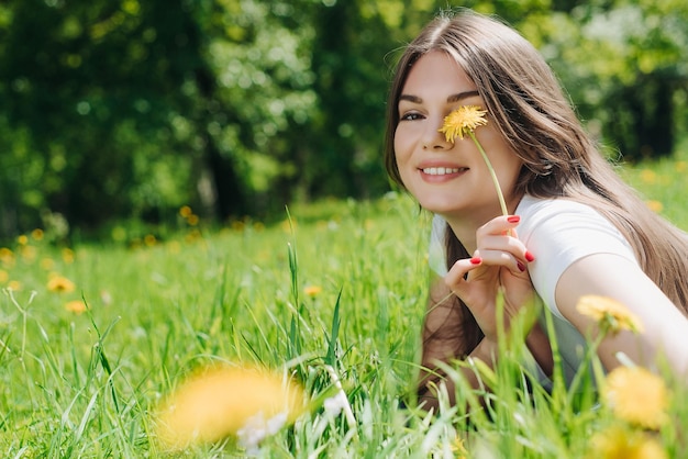 Woman laying on grass in park