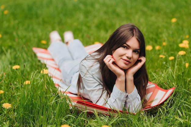 Woman laying on grass in park