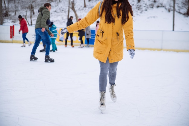 Woman learn to ski at city ice rink