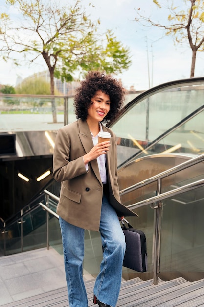 Woman leaving the subway station with a briefcase