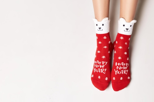 Woman legs in christmas socks