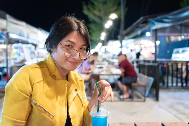 Woman LGBTQ posing with food at thai street food