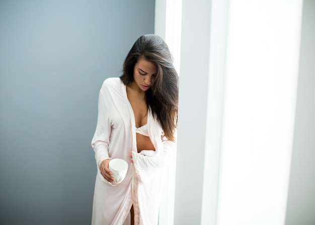 Woman in lingerie standing in the room