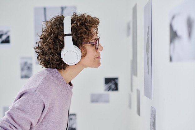 Woman listening to guide in headphones