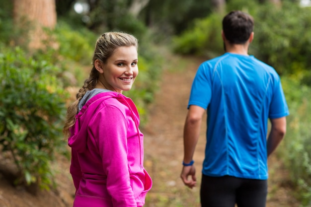 Woman looking back while taking walk