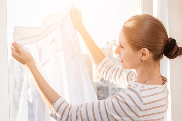 Woman looking at clean clothes