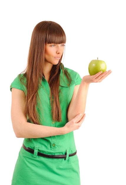 Woman looking at a green apple