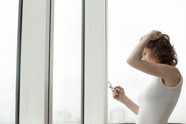 Woman looking at her mobile phone