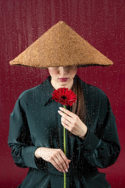 Woman looking out the window on a rainy day